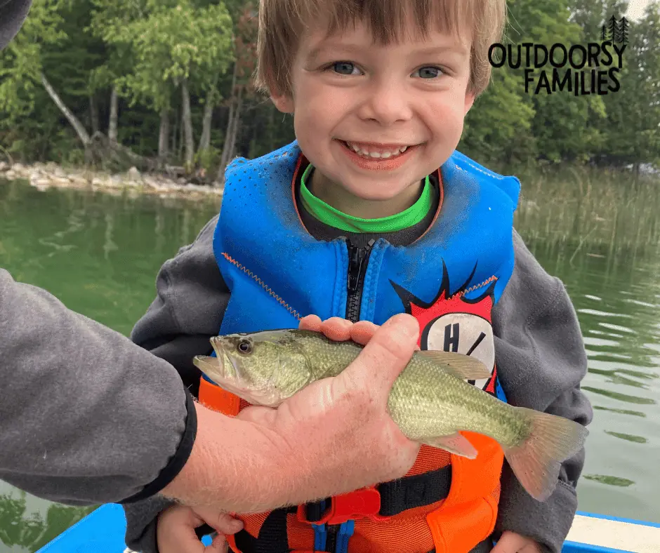Toddler with a fish he caught