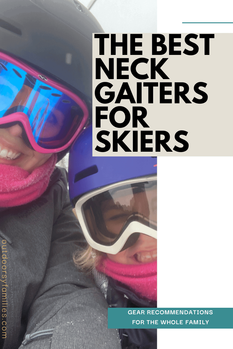 Mom and daughter on the chairlift. They are wearing matching pink neck gaiters and smiling.